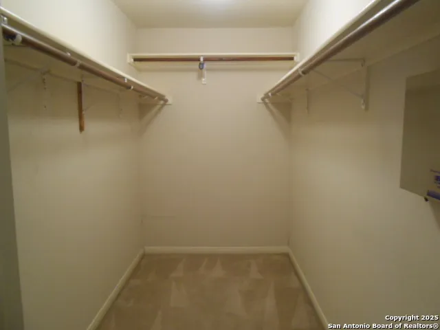 a kitchen that has a sink and a stove in it