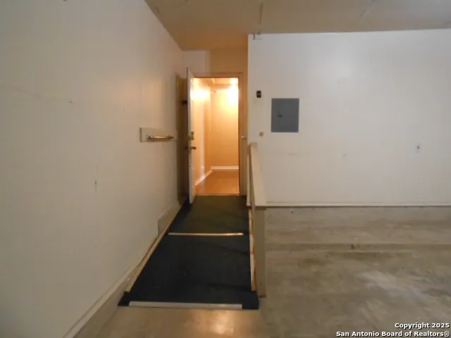 a room with a table and chairs