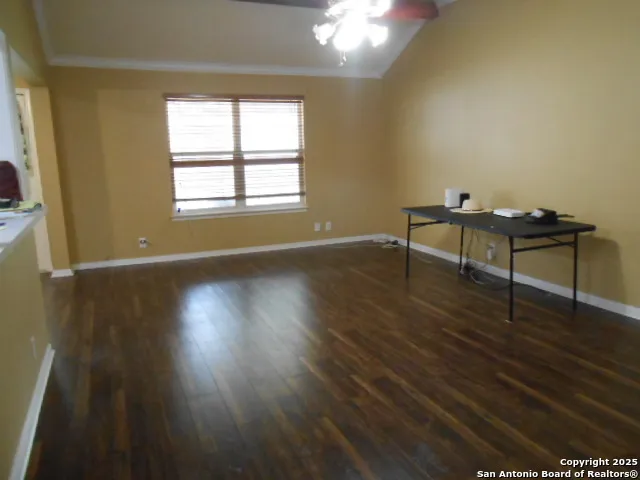 a view of a room with wooden floor