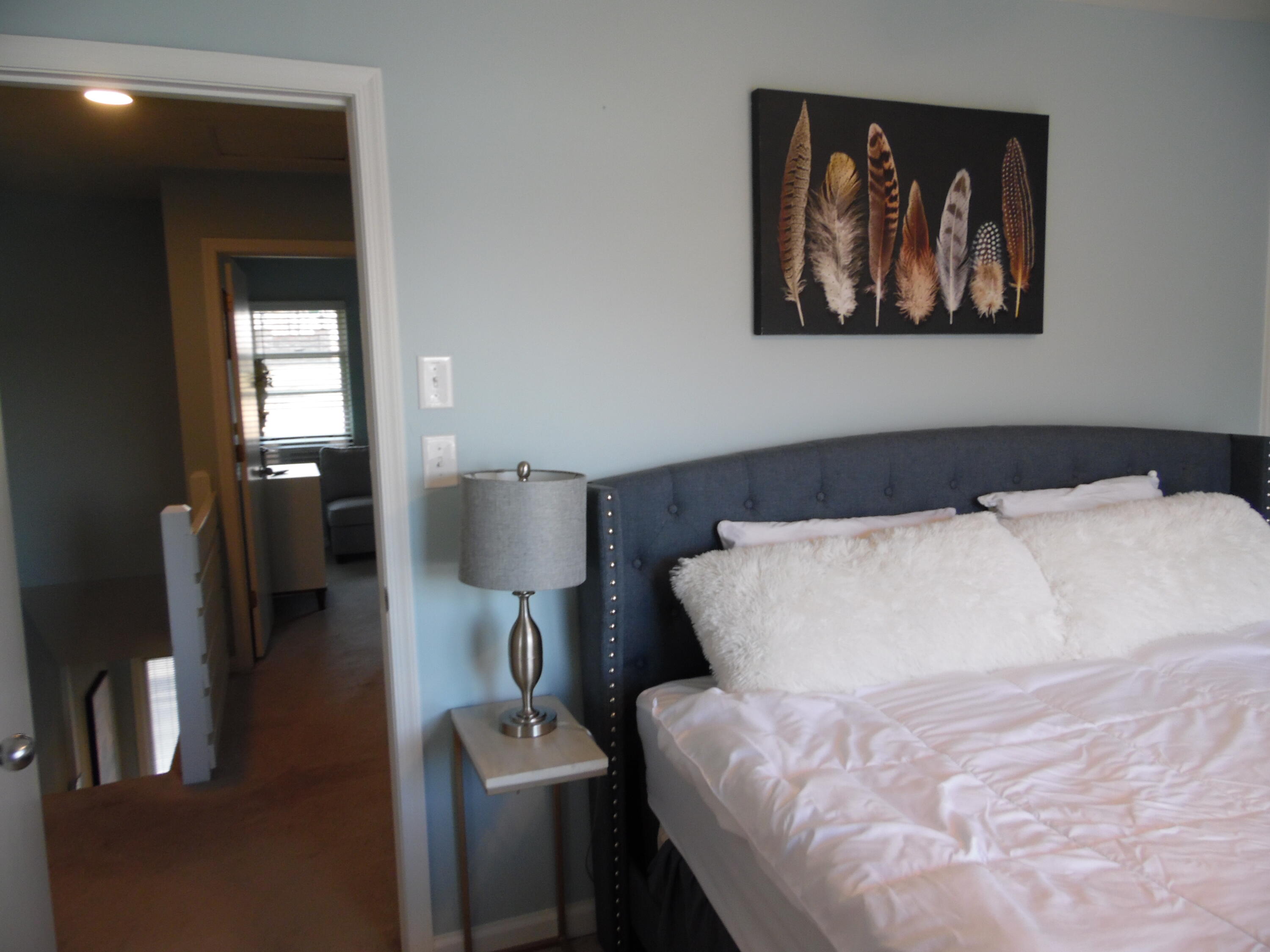 1788 Windlass Road, Unit C4 Moneta, VA 24121 - Photo 43 of 79 a bedroom with a bed and a painting on the wall
