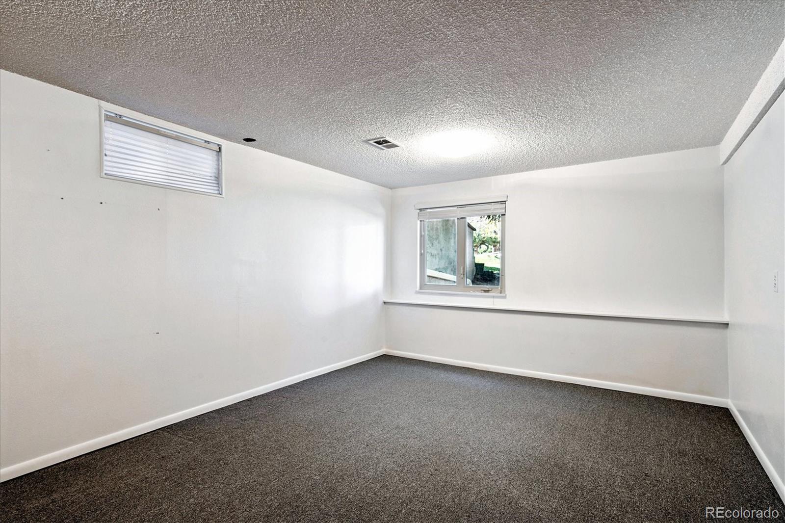 14935 West 58th Place Golden, CO 80403 - Photo 20 of 31 a view of an empty room with a window