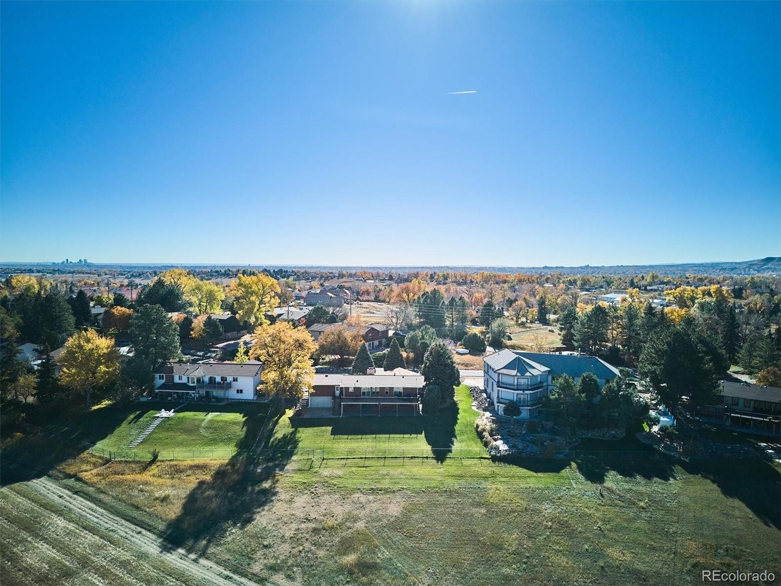 14935 West 58th Place Golden, CO 80403 - Photo 28 of 31 an aerial view of a golf course with chairs