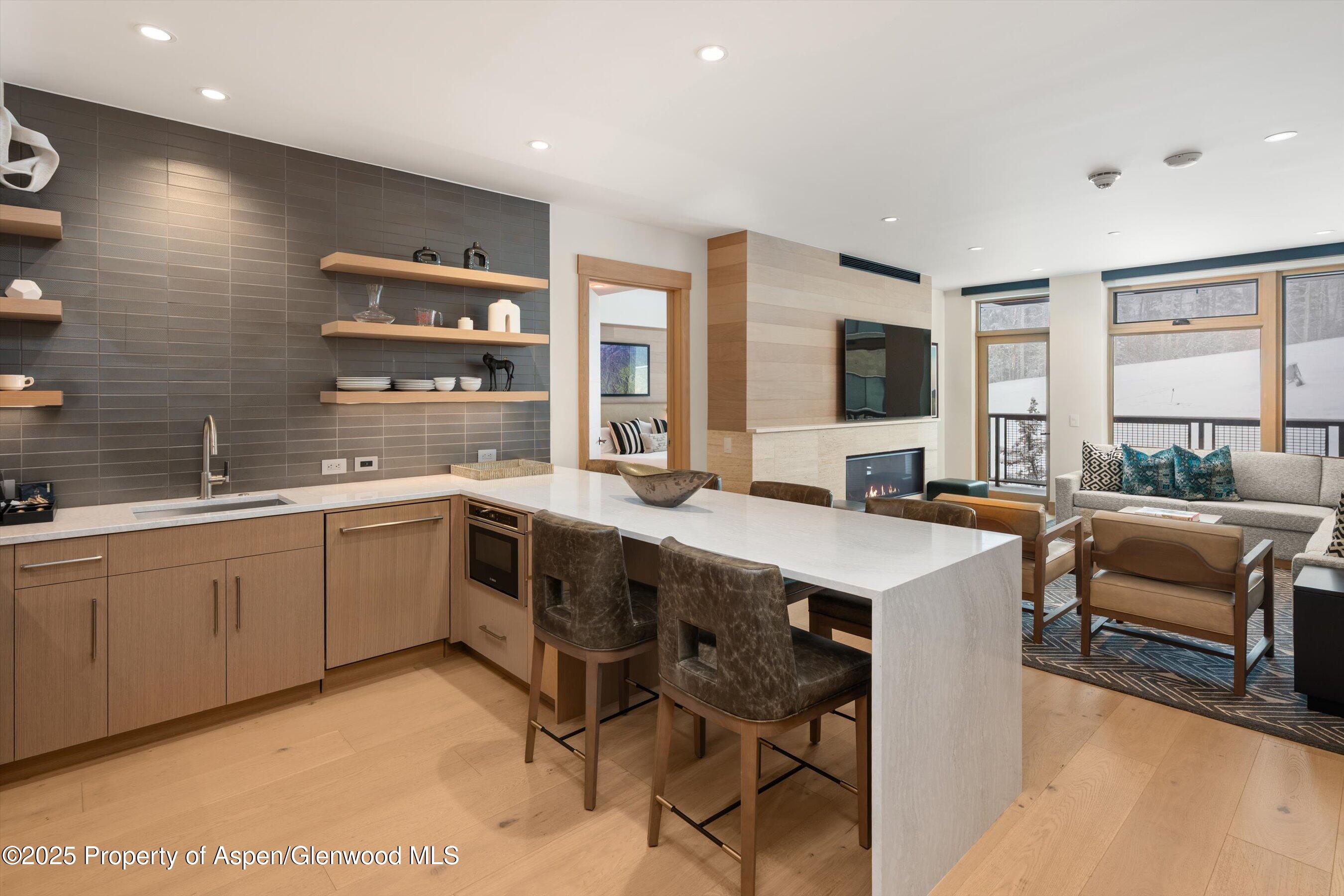 a large white kitchen with a large window