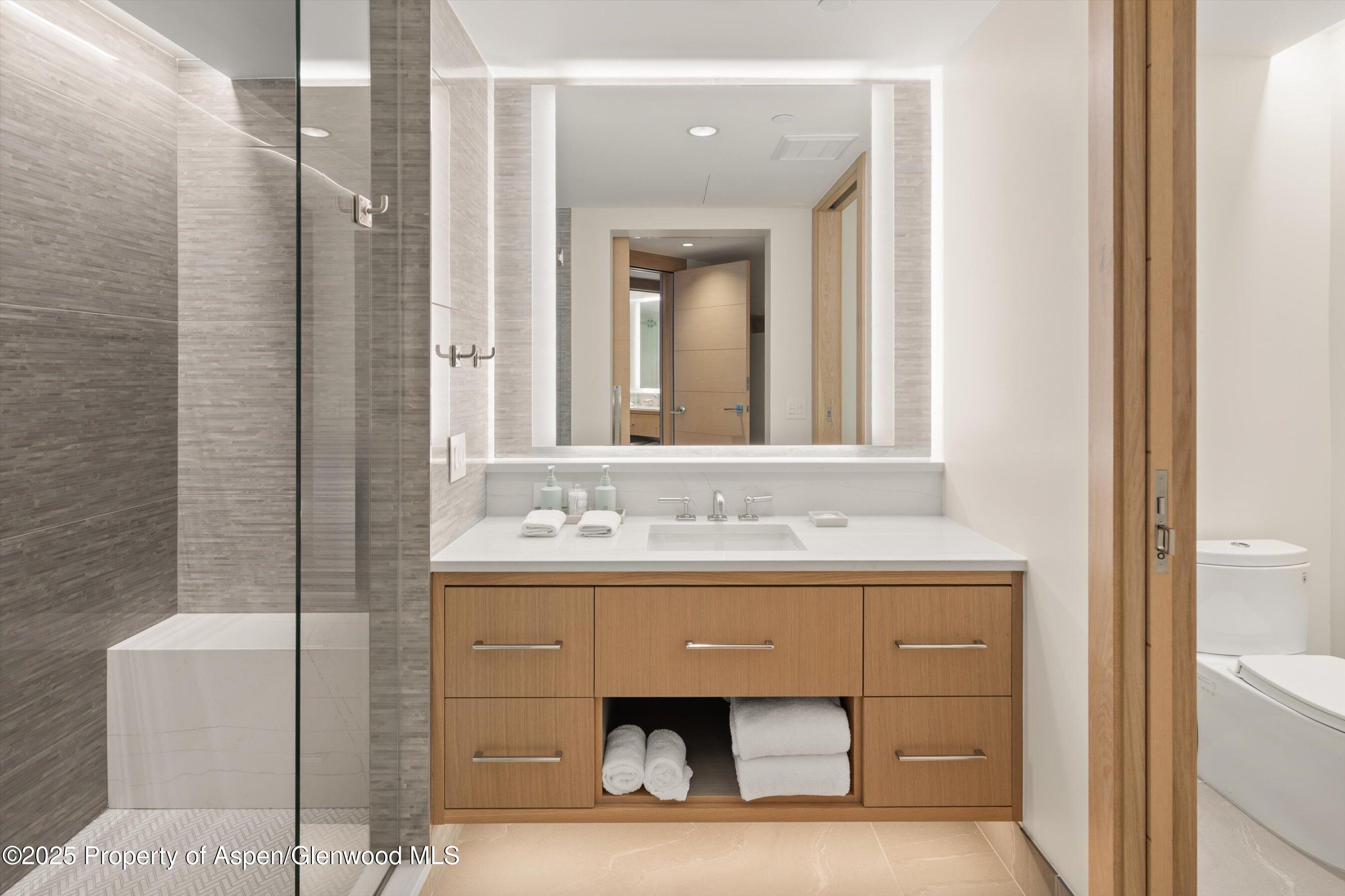 130 Wood Road, Unit 353355 Snowmass Village, CO 81615 - Photo 12 of 41 a bathroom with a sink and a mirror