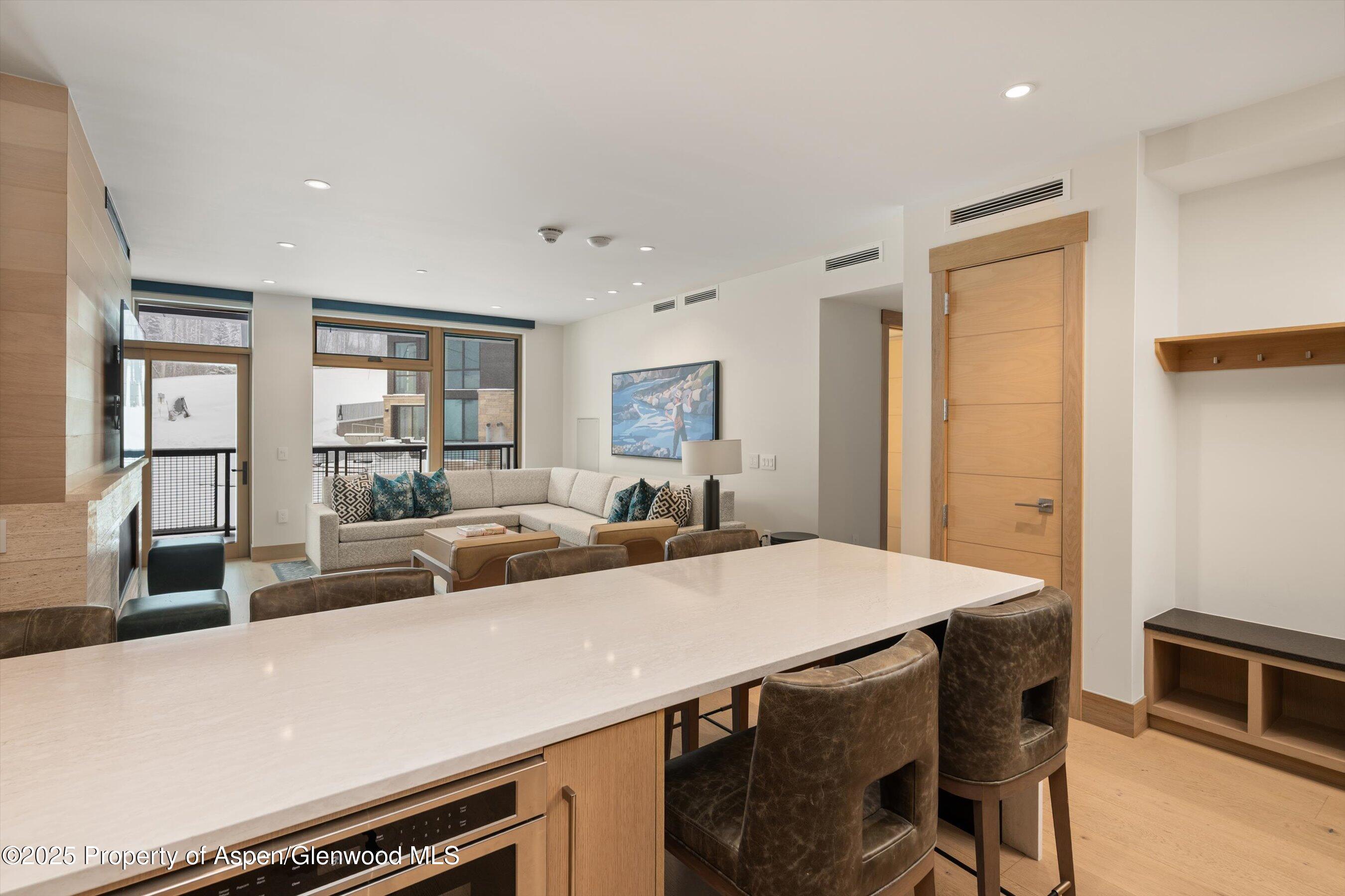 130 Wood Road, Unit 353355 Snowmass Village, CO 81615 - Photo 20 of 41 a view of a dining room with furniture and a livingroom