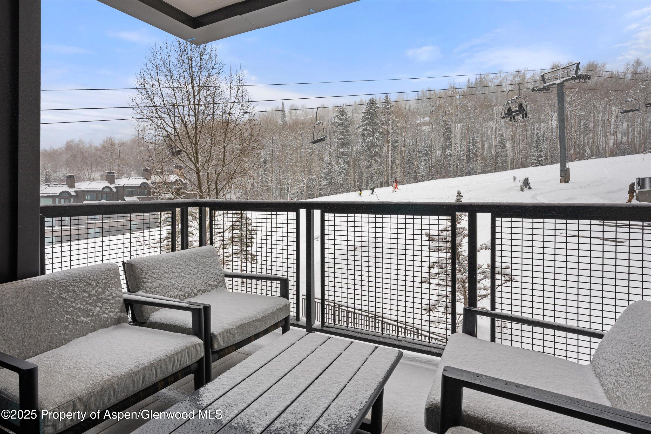 130 Wood Road, Unit 353355 Snowmass Village, CO 81615 - Photo 2 of 41 a view of roof deck with patio