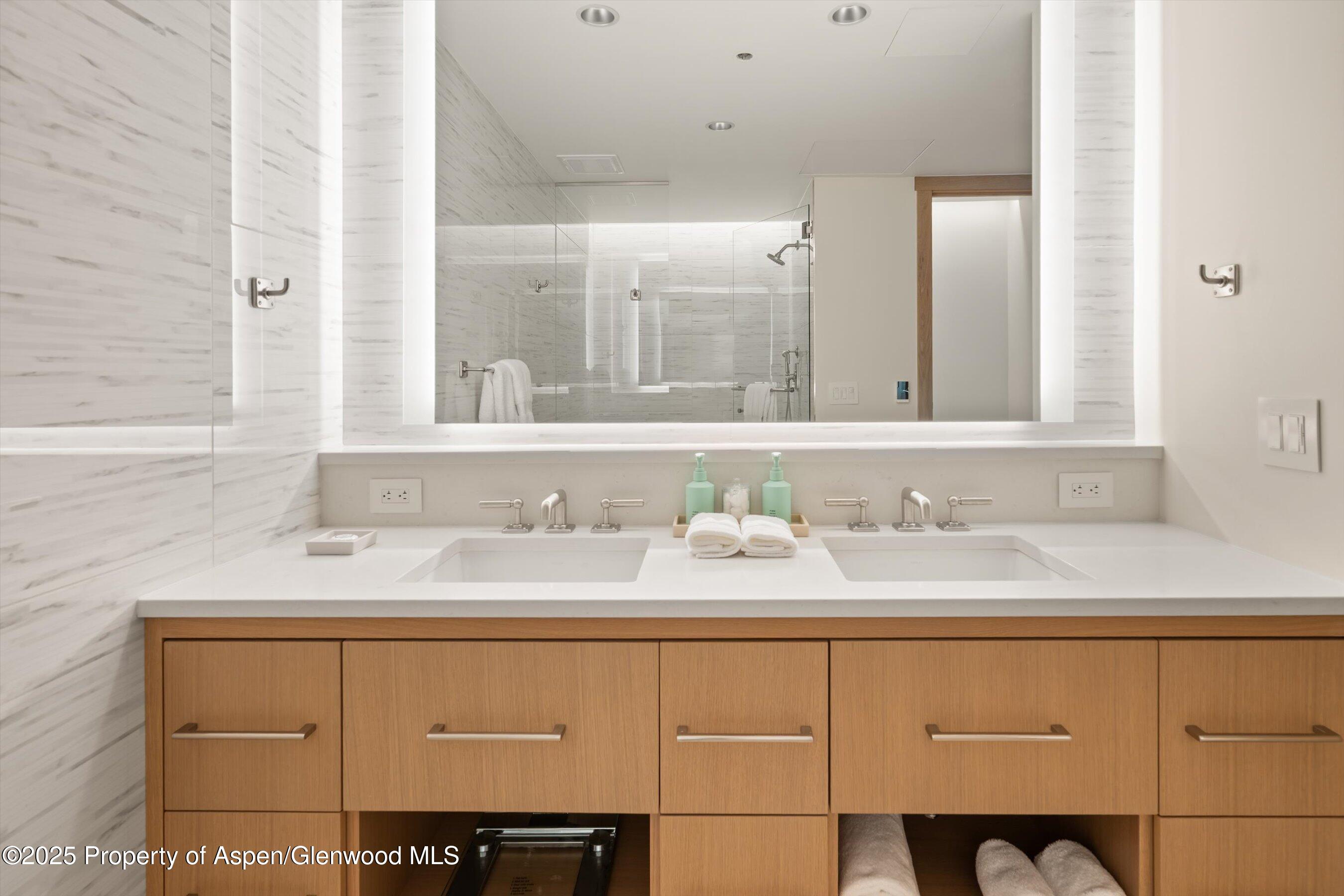 130 Wood Road, Unit 353355 Snowmass Village, CO 81615 - Photo 35 of 41 a bathroom with a sink and a mirror