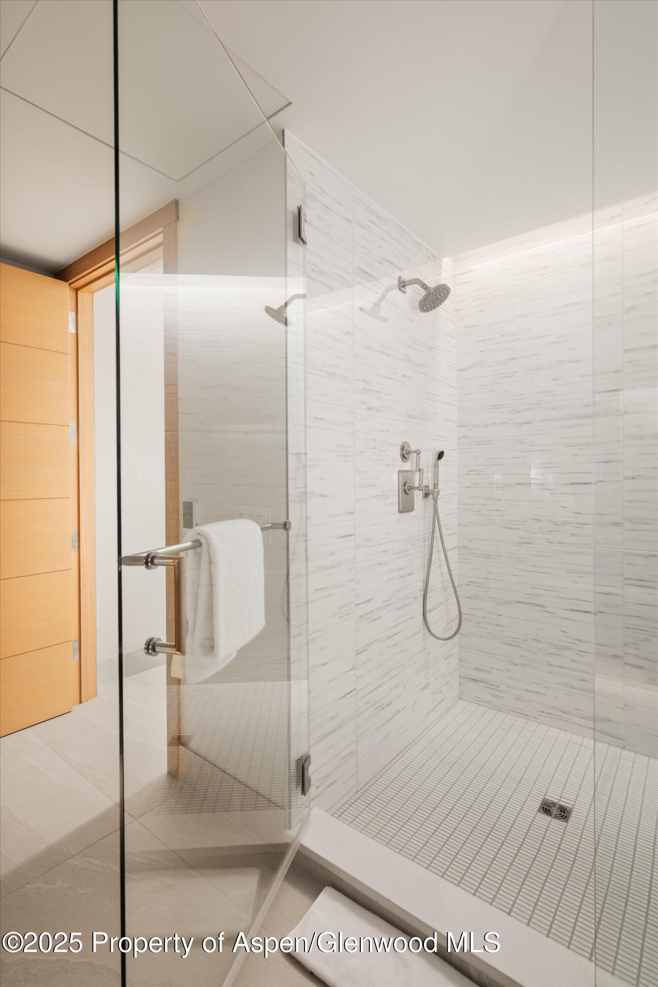 130 Wood Road, Unit 353355 Snowmass Village, CO 81615 - Photo 37 of 41 a bathroom with a glass shower door