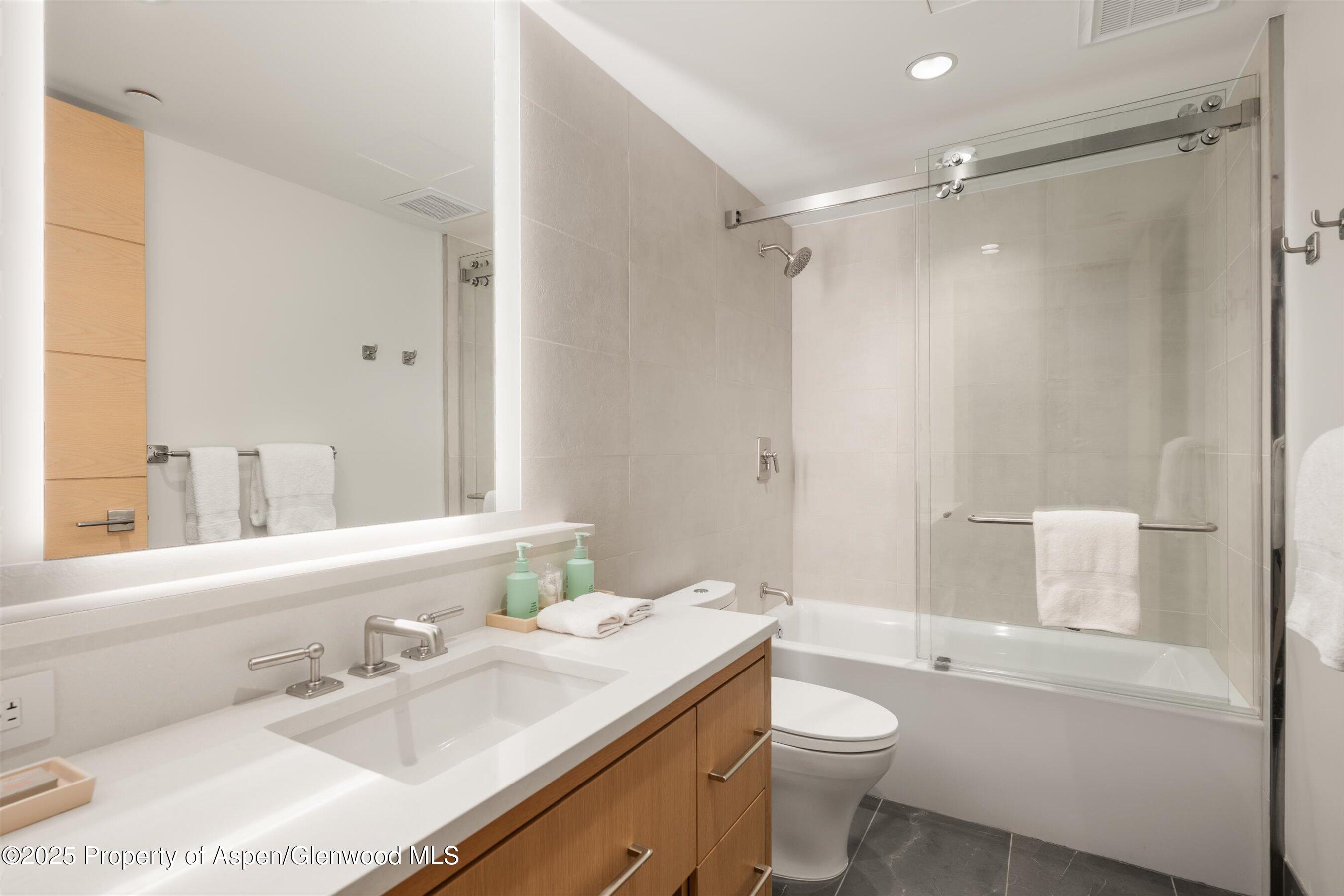 130 Wood Road, Unit 353355 Snowmass Village, CO 81615 - Photo 40 of 41 a bathroom with a sink a toilet and shower