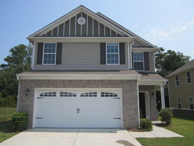 2502 Oakleaf Ridge Lithonia, GA 30058 - Photo 1 of 1 a front view of a house with a garage