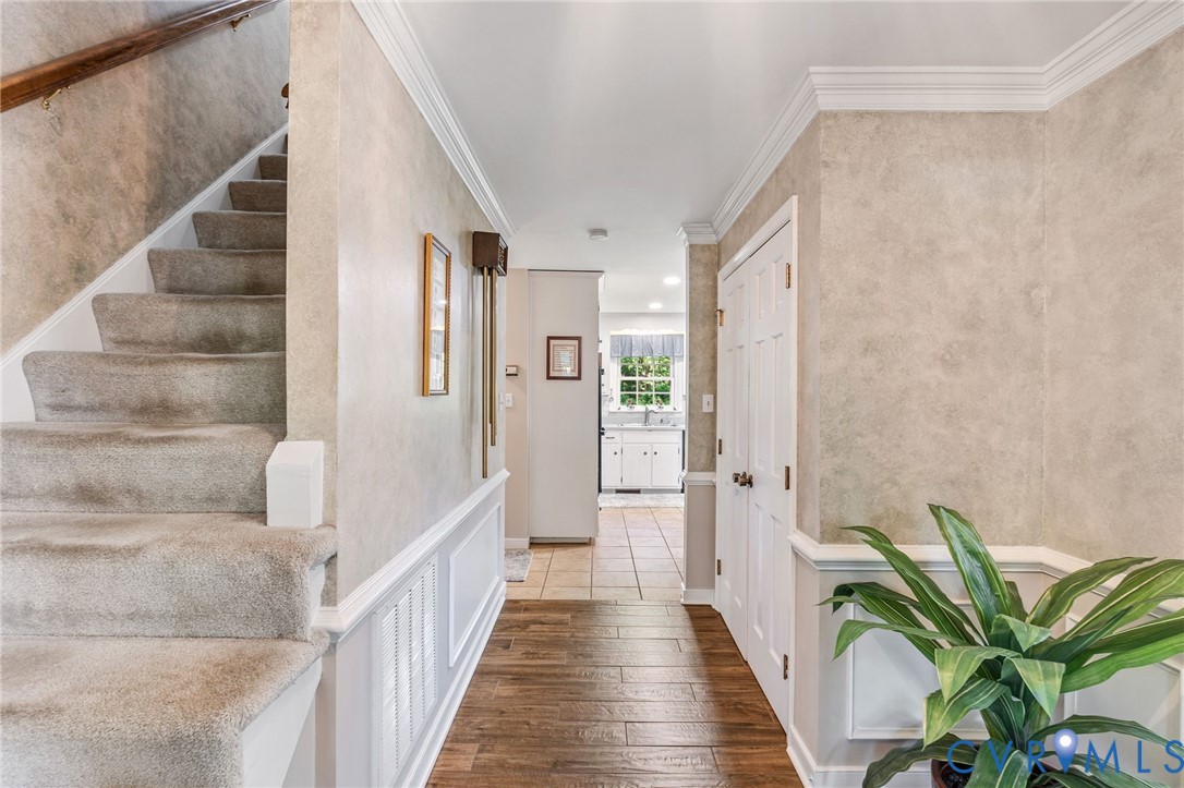 5700 Elfinwood Road Chester, VA 23831 - Photo 7 of 38 a view of a hallway with wooden floor and staircase