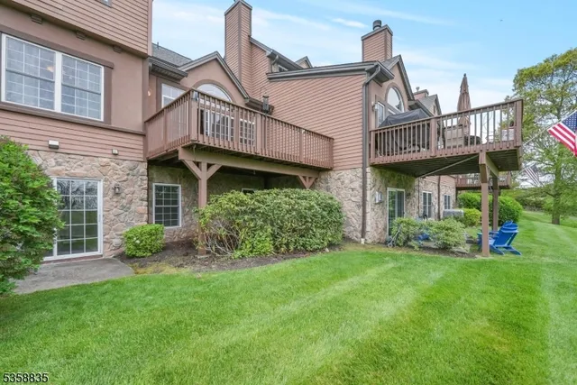 a view of a house with a yard and plants