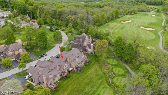 an aerial view of a house with a garden