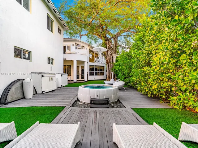 a front view of a house with garden and patio