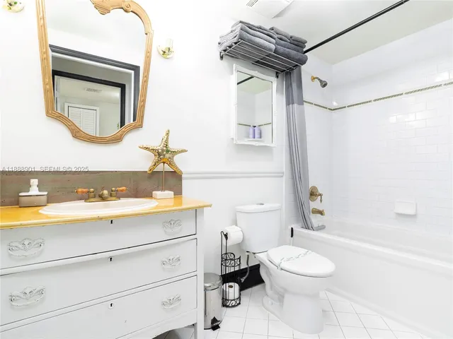 a bathroom with a toilet a sink and a bathtub