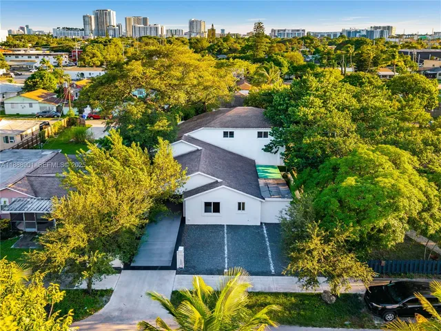 a aerial view of a house with a yard