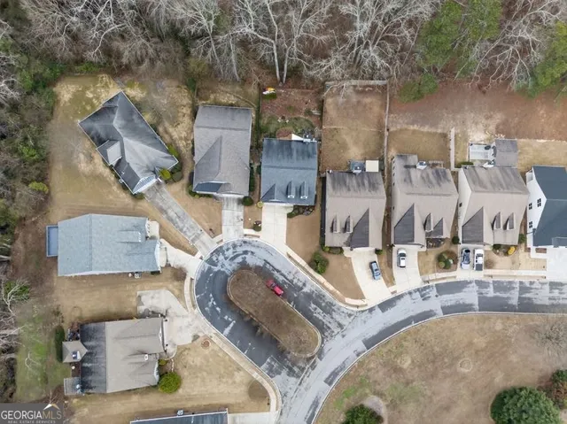 a kitchen with kitchen island granite countertop stainless steel appliances a sink stove top oven and cabinets