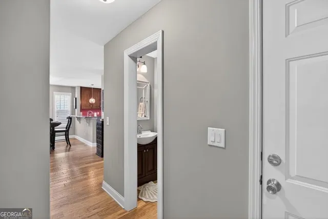a bathroom with a granite countertop double vanity sinks and a mirror