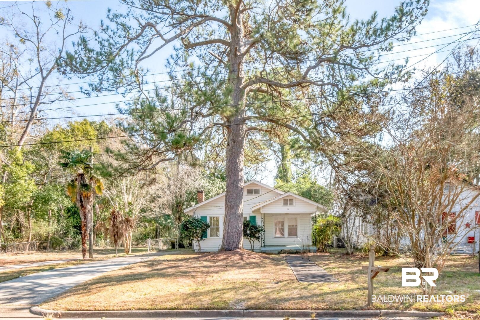 731 Jemison Street Mobile, AL 36606 - Photo 24 of 27 Bungalow-style house with covered porch, a chimney, and a front yard
