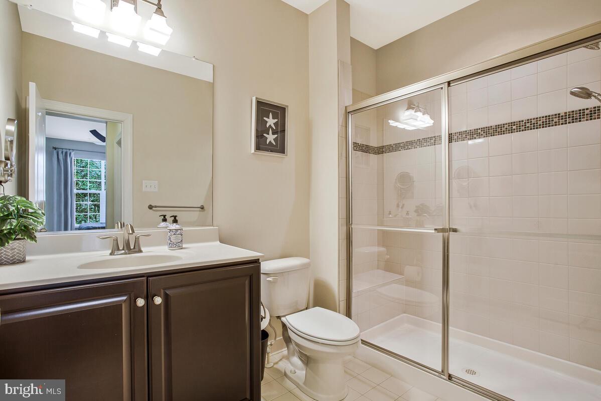 802 Phyllis Street Odenton, MD 21113 - Photo 16 of 35 a bathroom with a sink toilet and shower