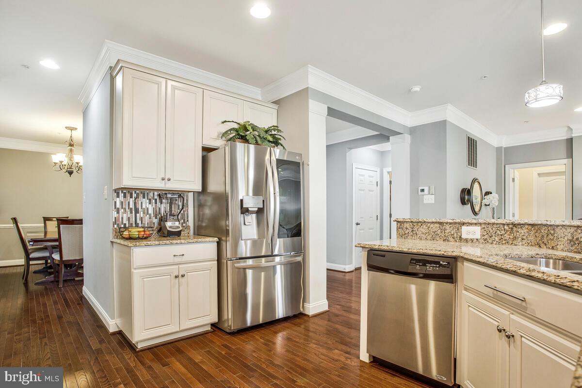 802 Phyllis Street Odenton, MD 21113 - Photo 5 of 35 a kitchen with white cabinets and stainless steel appliances