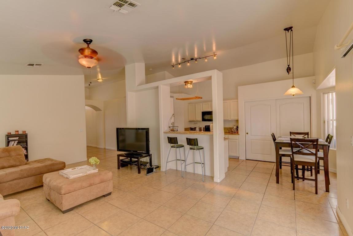 5311 West Fireopal Way Tucson, AZ 85742 - Photo 2 of 14 a living room with furniture and a flat screen tv