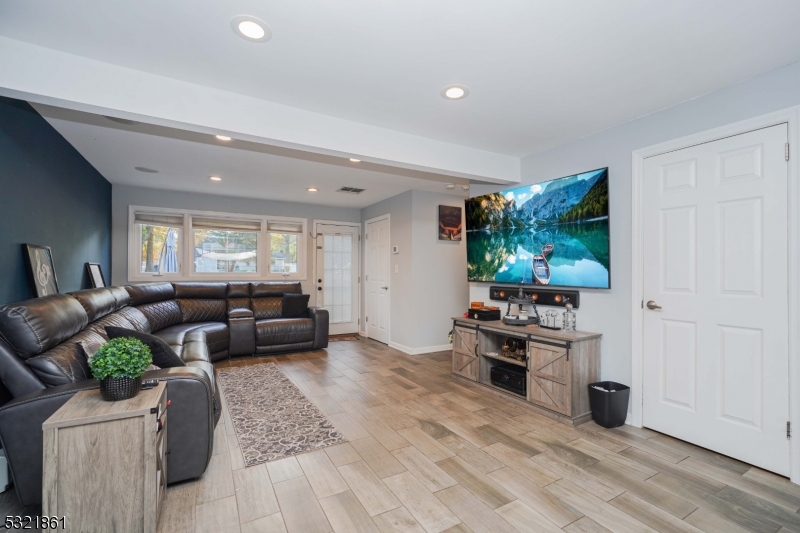 13 Bartle Road Somerset, NJ 08873 - Photo 12 of 24 a living room with furniture and a flat screen tv