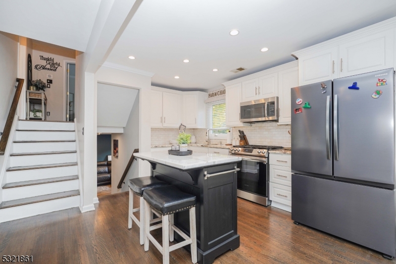 13 Bartle Road Somerset, NJ 08873 - Photo 8 of 24 a kitchen with stainless steel appliances a refrigerator and a stove top oven