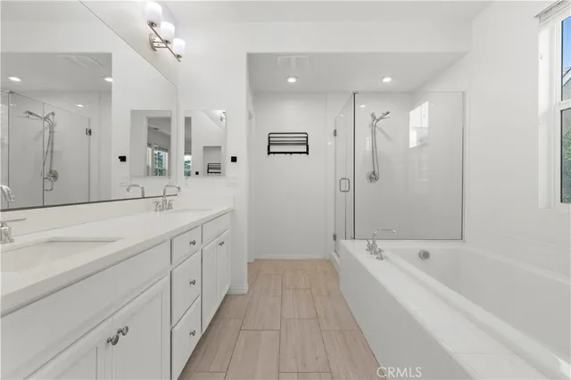 a kitchen with a sink cabinets and wooden floor