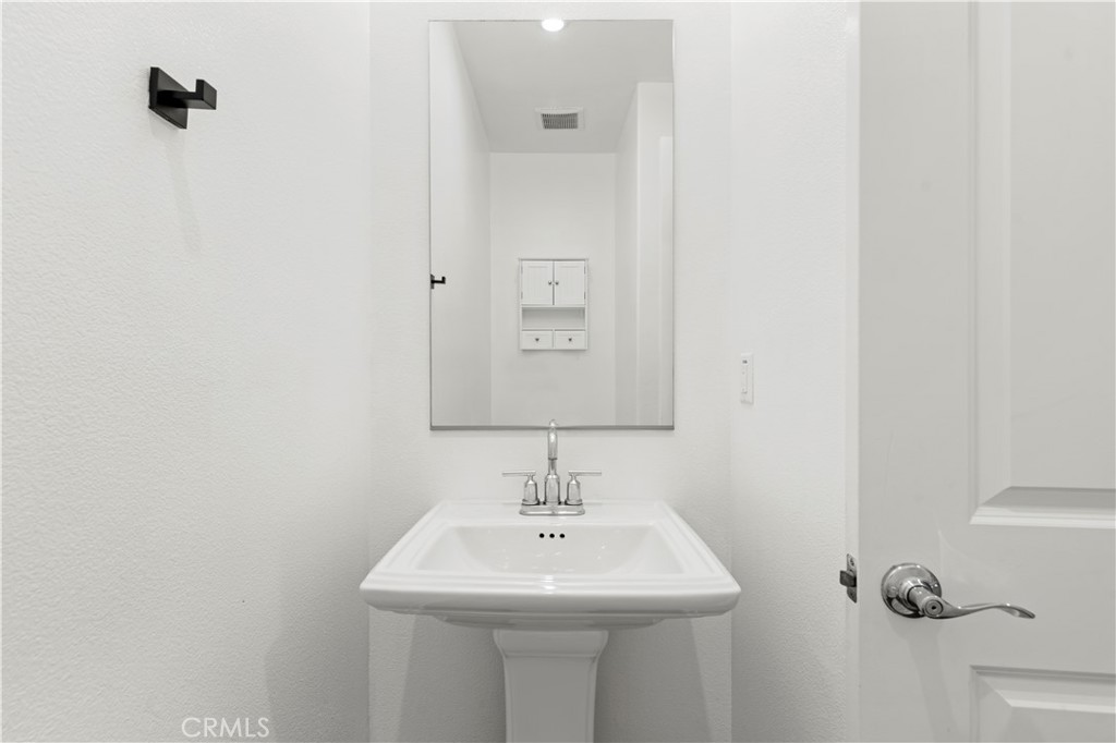 166 Natal Road Rancho Mission Viejo, CA 92694 - Photo 26 of 45 a bathroom with a sink and a mirror