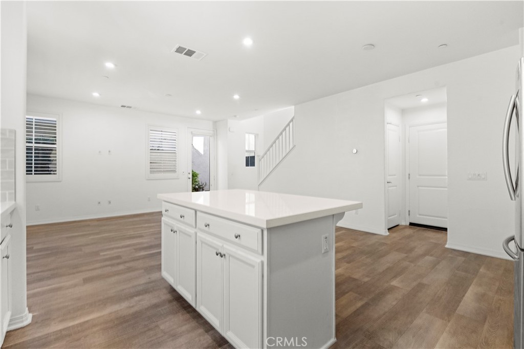 166 Natal Road Rancho Mission Viejo, CA 92694 - Photo 27 of 45 a kitchen with a sink cabinets and wooden floor