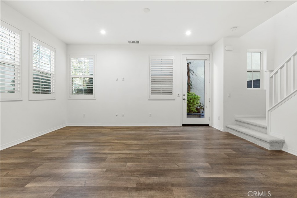 166 Natal Road Rancho Mission Viejo, CA 92694 - Photo 31 of 45 a view of an empty room with wooden floor and a window