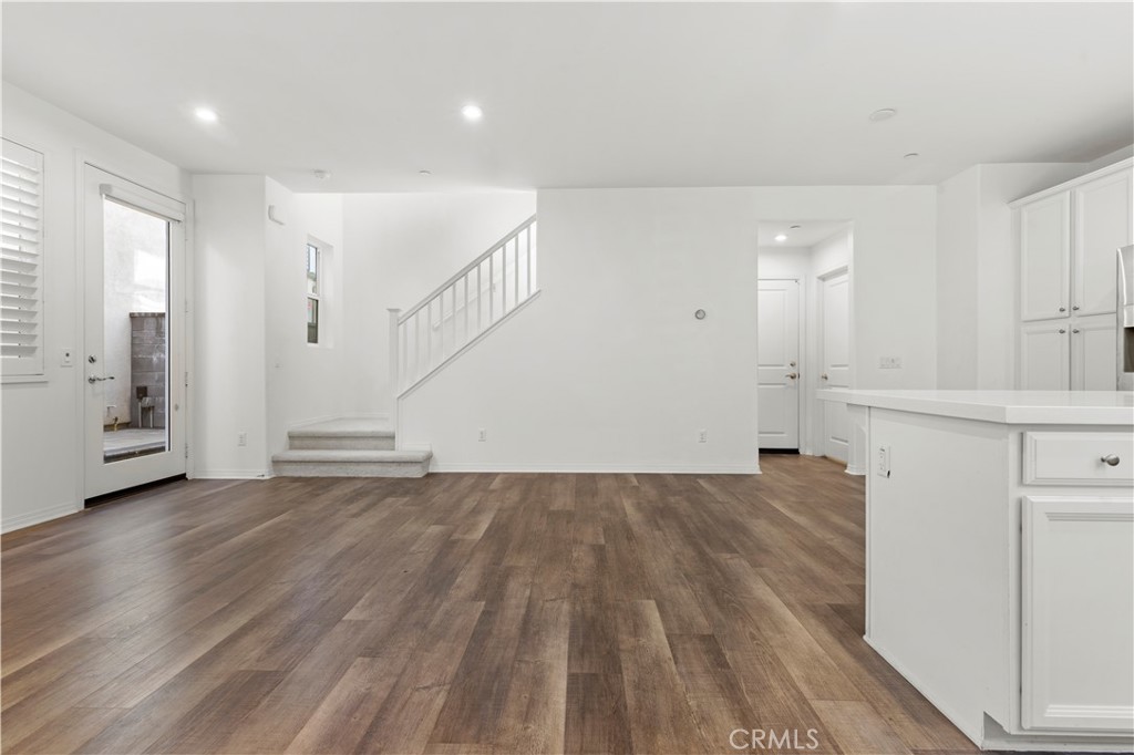 166 Natal Road Rancho Mission Viejo, CA 92694 - Photo 32 of 45 a view of a kitchen with wooden floor and electronic appliances