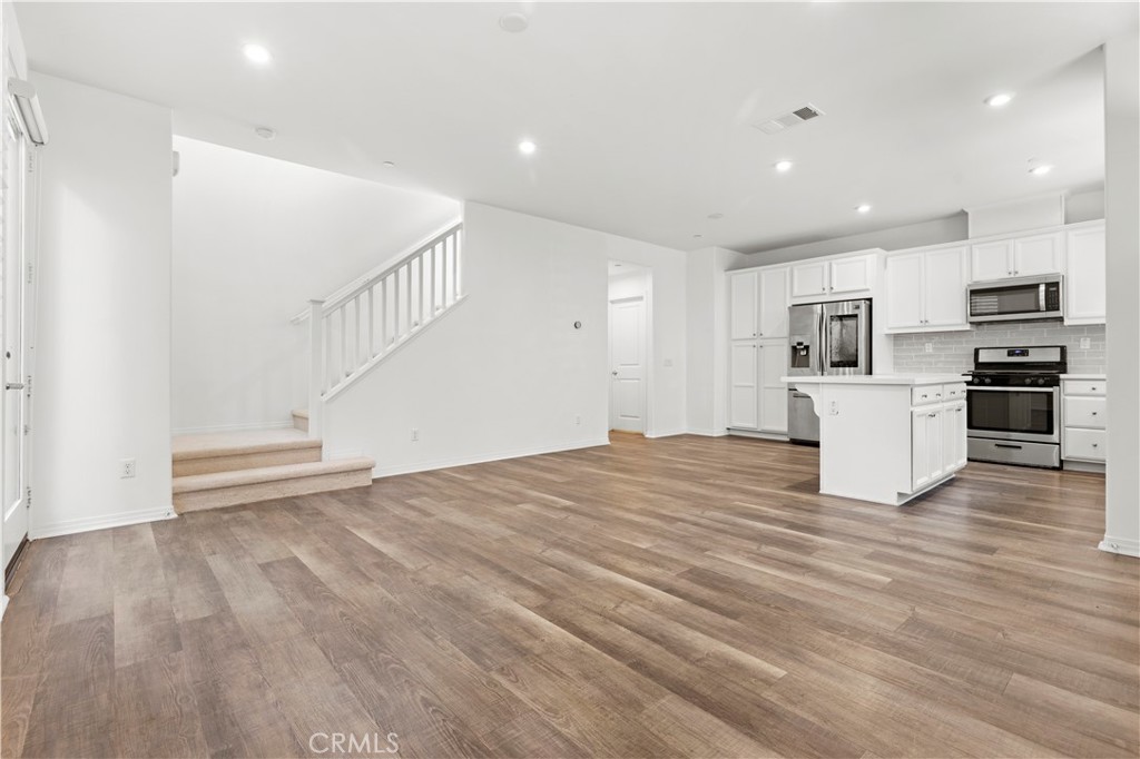 166 Natal Road Rancho Mission Viejo, CA 92694 - Photo 33 of 45 a view of kitchen and wooden floor