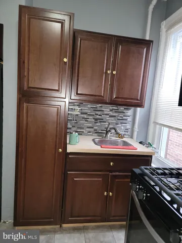 a kitchen with a sink and a stove