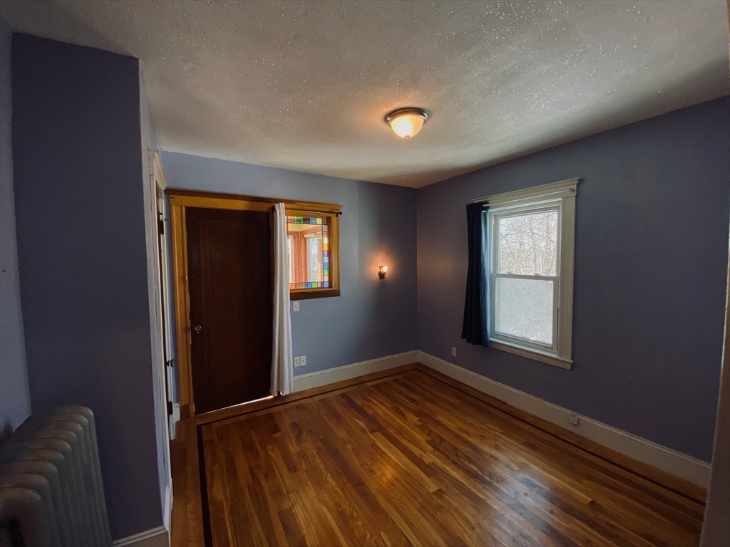 2-4 Sunset Hill Road Boston, MA 02132 - Photo 21 of 34 an empty room with windows