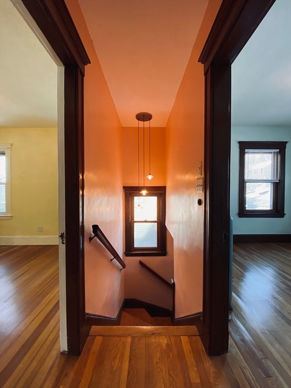 2-4 Sunset Hill Road Boston, MA 02132 - Photo 31 of 34 a view of a room with wooden floor and a window