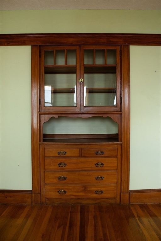 2-4 Sunset Hill Road Boston, MA 02132 - Photo 10 of 34 a view of room with wooden floor and cabinet