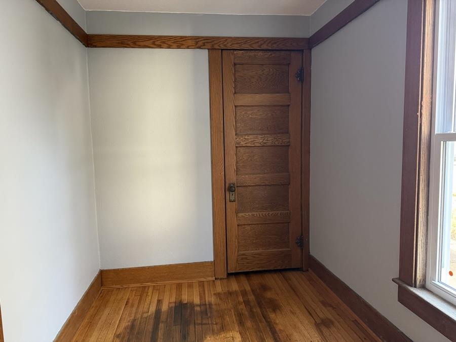 816 West Pleasant Street Freeport, IL 61032 - Photo 26 of 42 wooden floor in an empty room