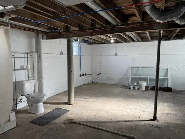 a bathroom with a shower and toilet