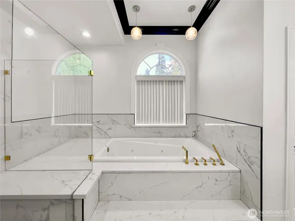 a bathroom with a bathtub and a shower