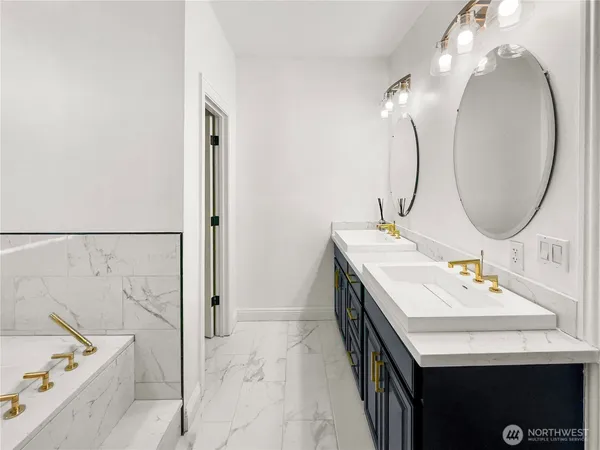 a bathroom with a sink double vanity and a mirror