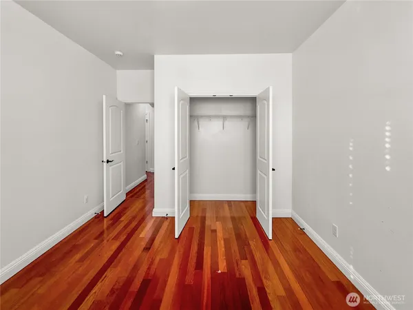 a view of a room with wooden floor and wooden floor