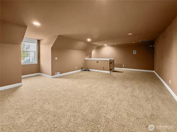 a view of a room with a projector and screen