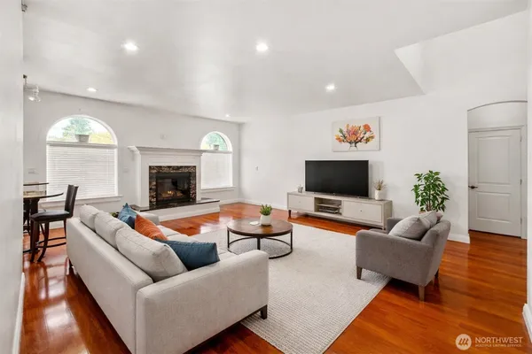 a living room with furniture and a flat screen tv