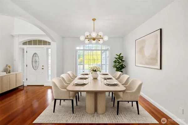 a view of a dining room with furniture window and wooden floor