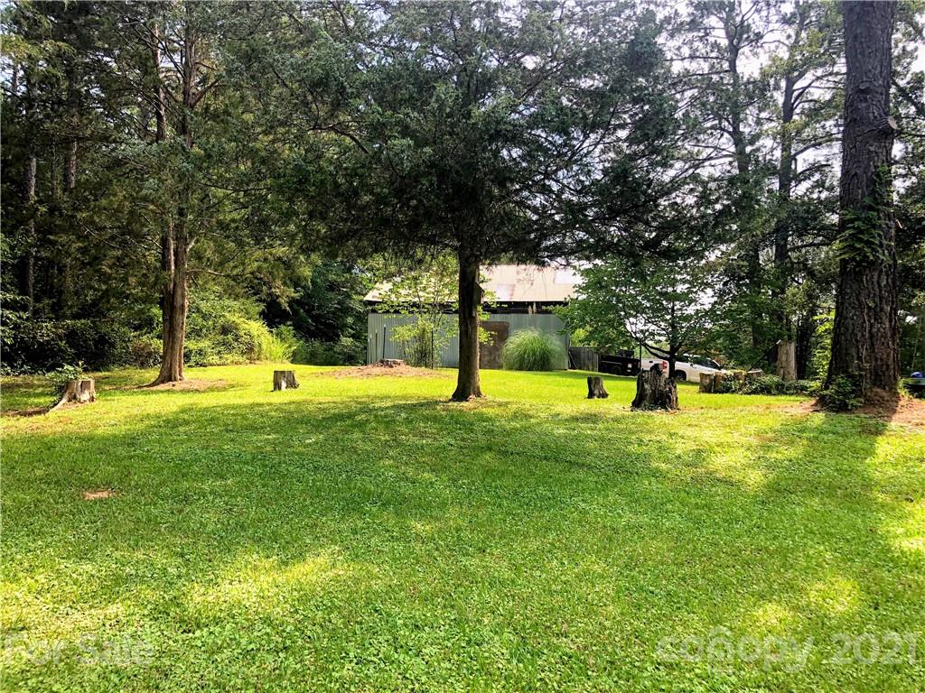 373 North Burris Road Sharon, SC 29742 - Photo 14 of 36 a view of yard with swimming pool and trees