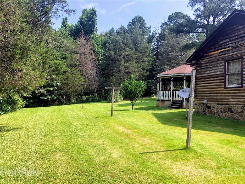 373 North Burris Road Sharon, SC 29742 - Photo 15 of 36 a view of swimming pool with lawn chairs and plants