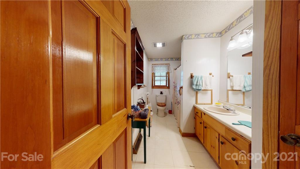 373 North Burris Road Sharon, SC 29742 - Photo 25 of 36 a spacious bathroom with a double vanity sink a mirror and a bathtub