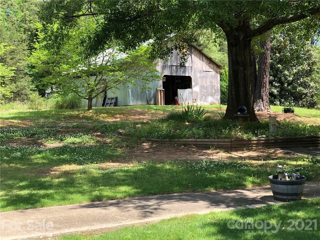 373 North Burris Road Sharon, SC 29742 - Photo 6 of 36 a front view of a house with garden